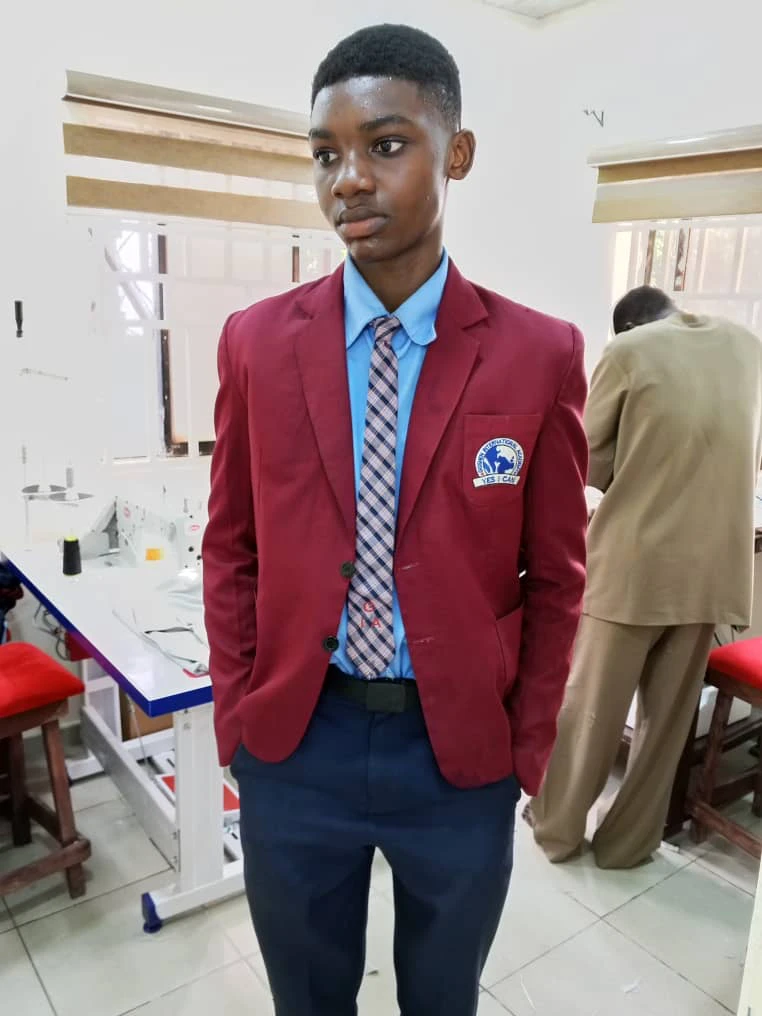 young man modeling a school uniform blazer